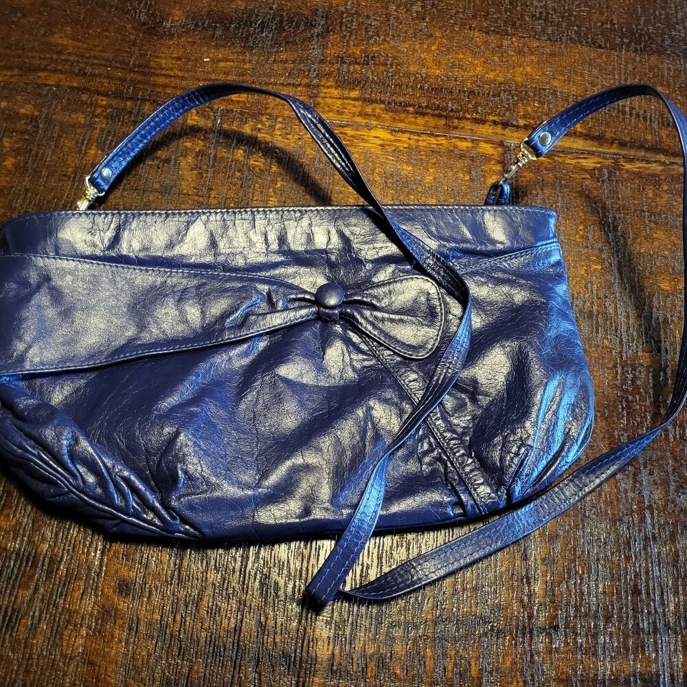 Vintage purple crossbody purse with a bow